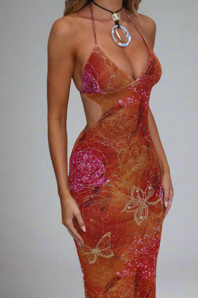 AURÉSSA – Vestido largo con cristales dorados.